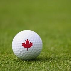 Golf ball printed with a red maple leaf