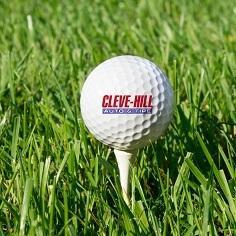 Golf ball printed with the Cleve-Hill Auto and Tire logo, on a tee